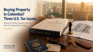 Editorial hero image showing Colombian property closing documents, architectural plans, a U.S. passport, Colombian cédula, keys, and notary items on a walnut table with a Colombian city skyline in the background.